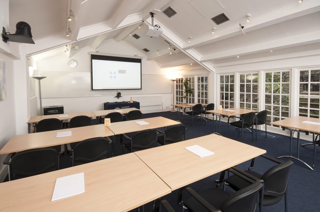 Photo of a large meeting room in a classroom style