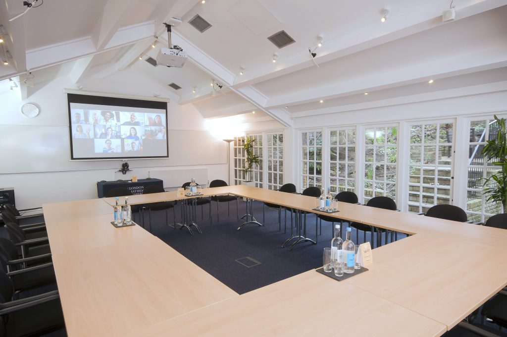 Photo of a large meeting room in a boardroom style