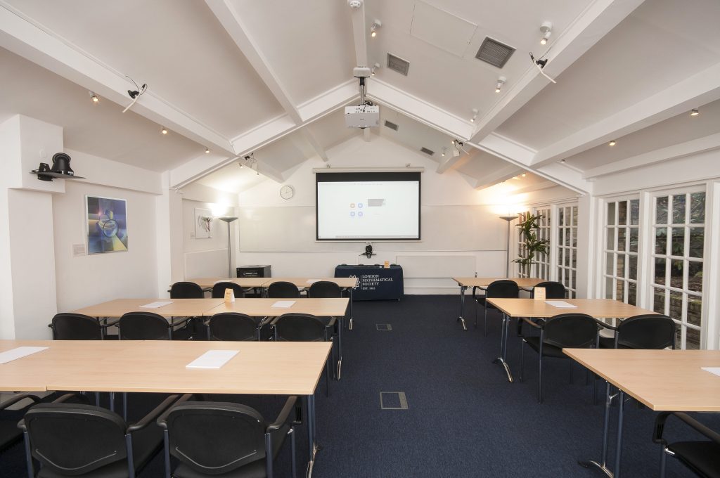 Photo of a large meeting room in a classroom style